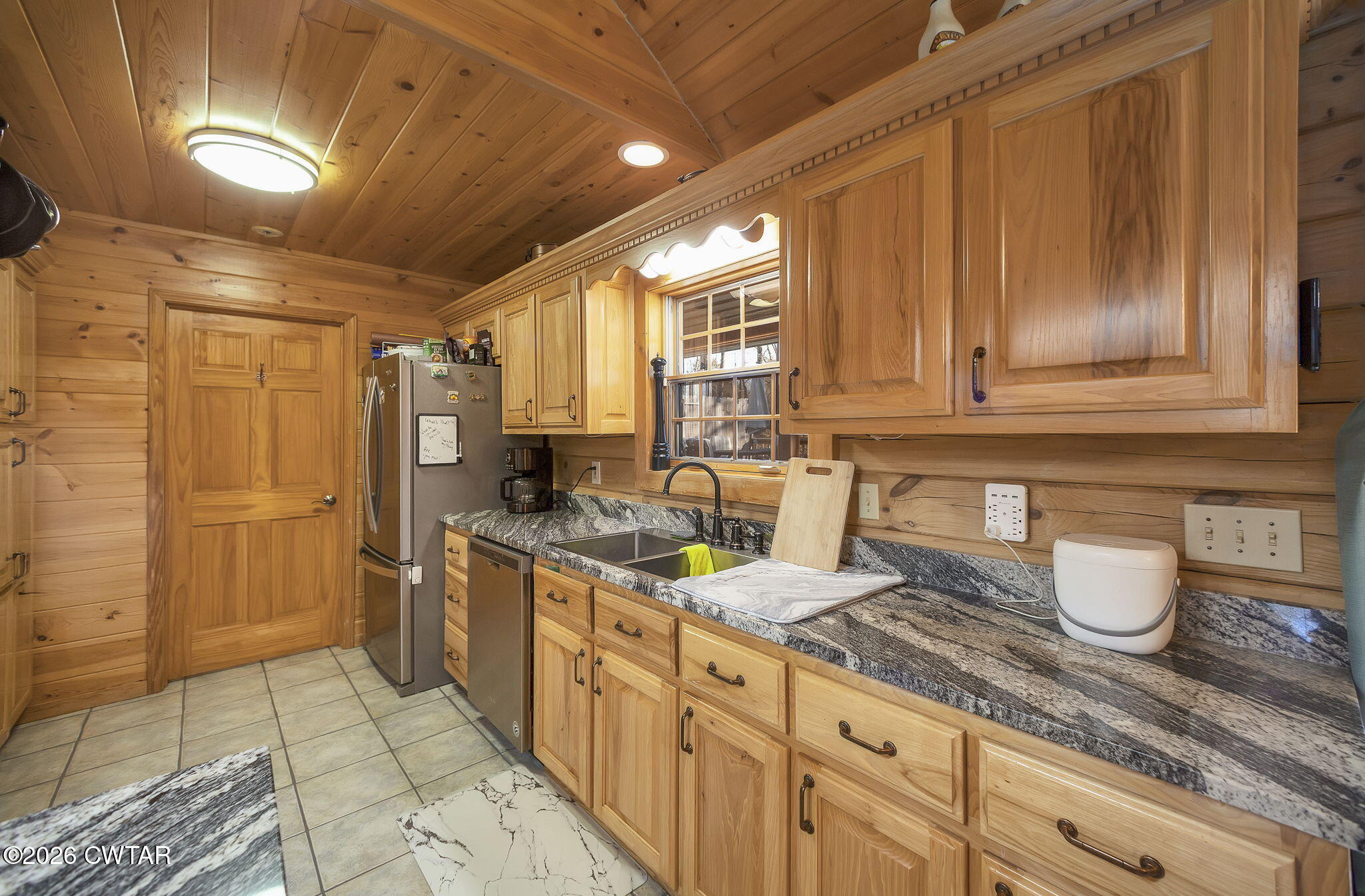 372 Aubrey Fergerson Road Gadsden, TN 38337 - Photo 13 of 50 a kitchen with stainless steel appliances granite countertop a sink stove and refrigerator