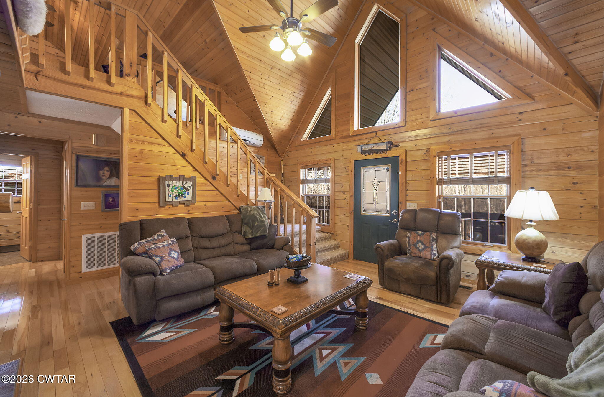 372 Aubrey Fergerson Road Gadsden, TN 38337 - Photo 15 of 50 a living room with furniture a fireplace and a large window