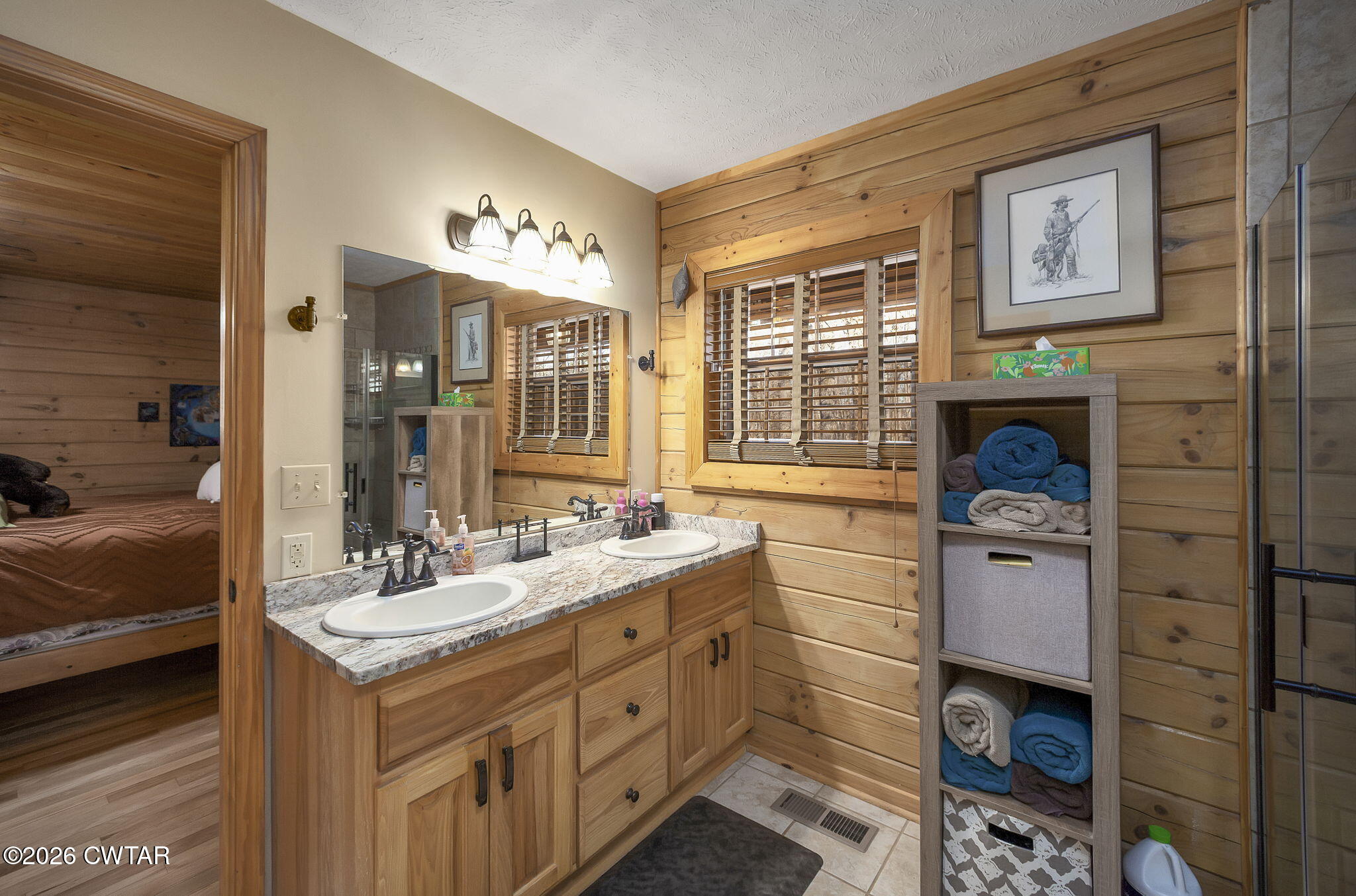 372 Aubrey Fergerson Road Gadsden, TN 38337 - Photo 20 of 50 a en suite bathroom with double vanity mirrors and mirrors
