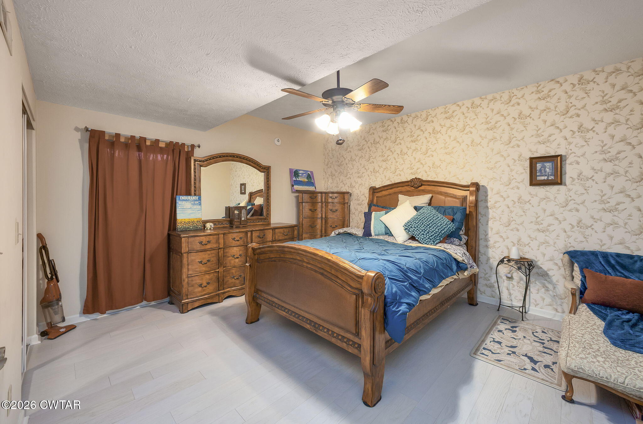 372 Aubrey Fergerson Road Gadsden, TN 38337 - Photo 26 of 50 a bedroom with a bed and a chandelier