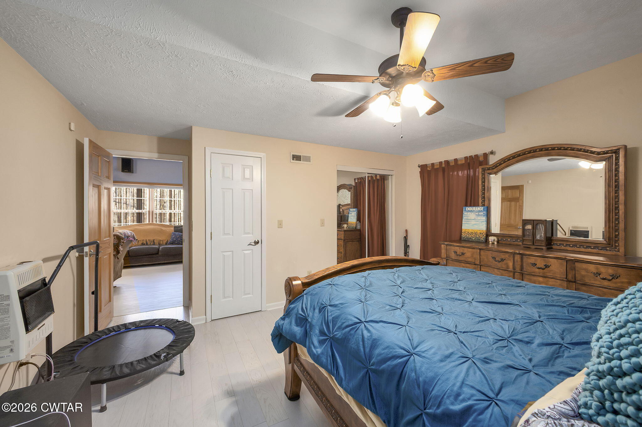 372 Aubrey Fergerson Road Gadsden, TN 38337 - Photo 28 of 50 a bedroom with a large bed a flat tv screen and dresser