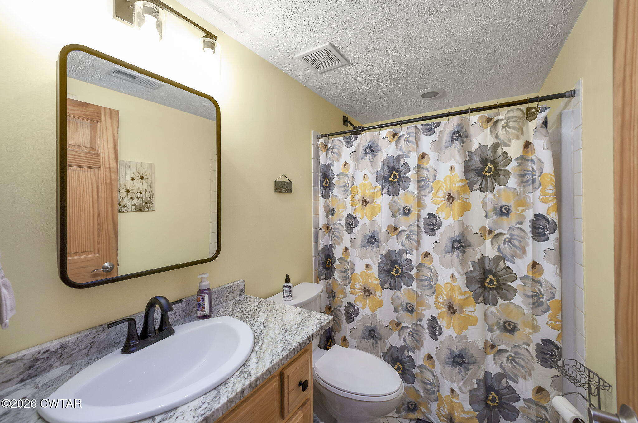 372 Aubrey Fergerson Road Gadsden, TN 38337 - Photo 29 of 50 a bathroom with a granite countertop sink mirror and toilet