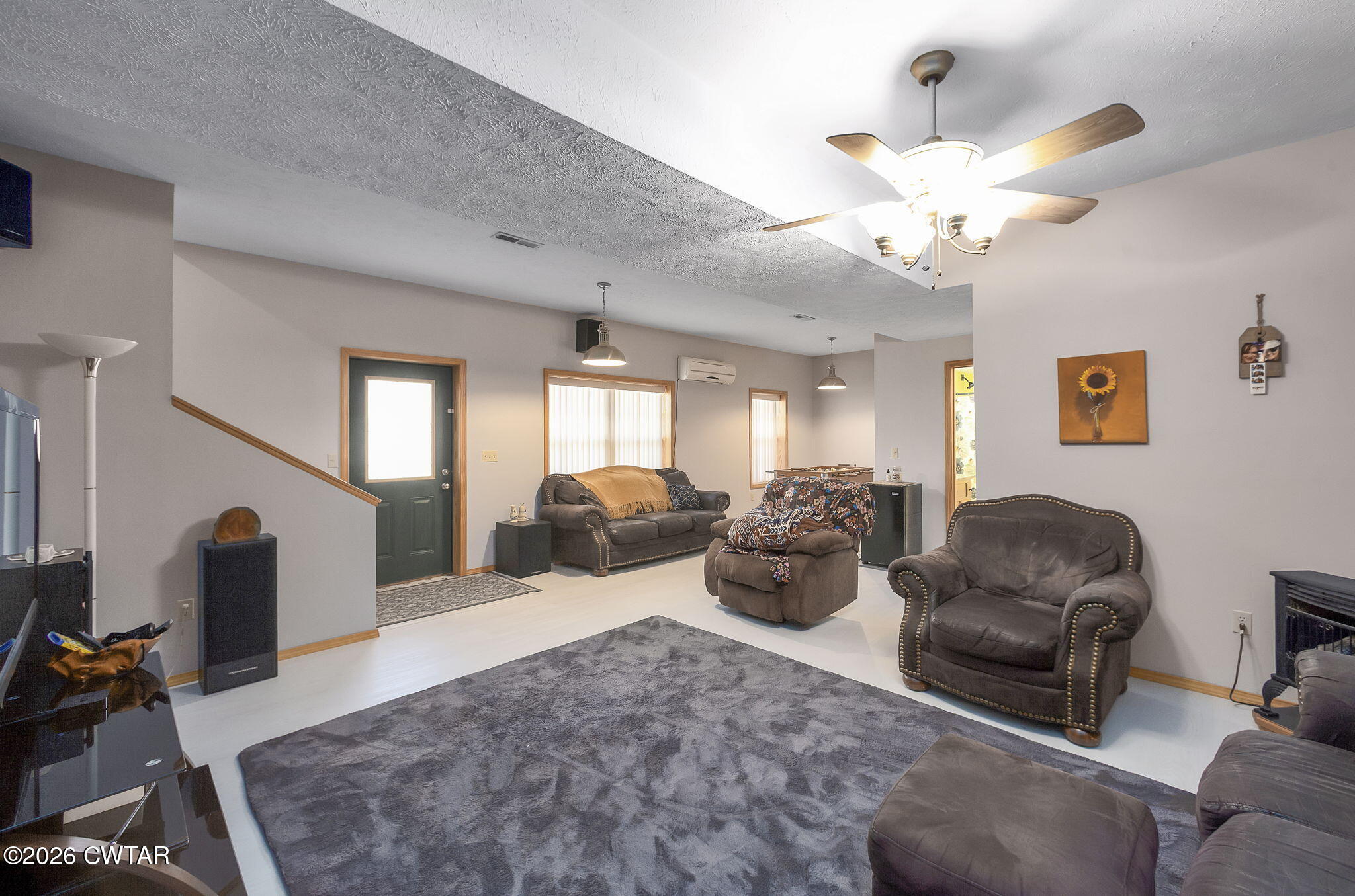 372 Aubrey Fergerson Road Gadsden, TN 38337 - Photo 32 of 50 a living room with furniture a chandelier and a flat screen tv