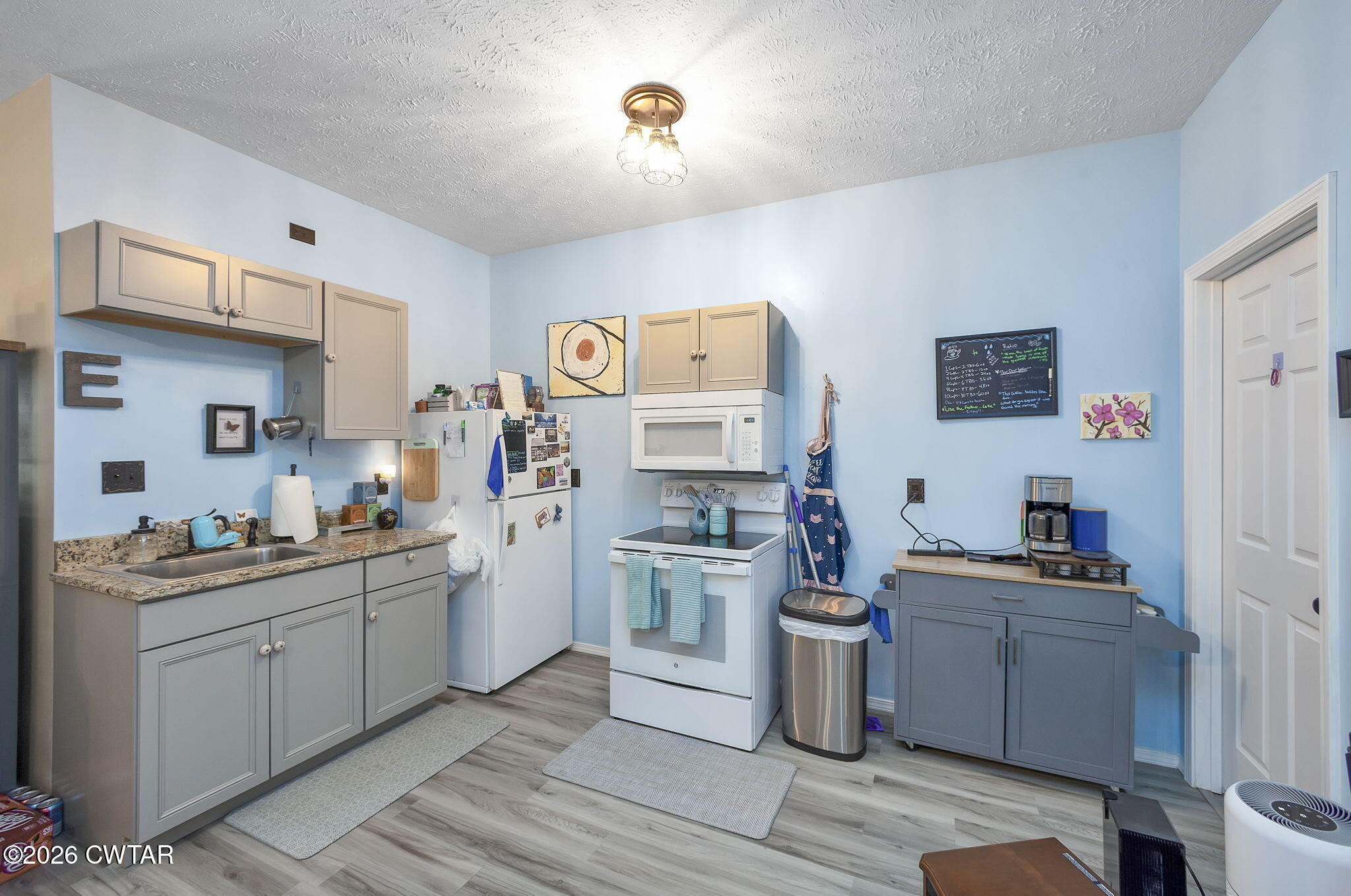 372 Aubrey Fergerson Road Gadsden, TN 38337 - Photo 42 of 50 a kitchen with a stove top oven sink and cabinets