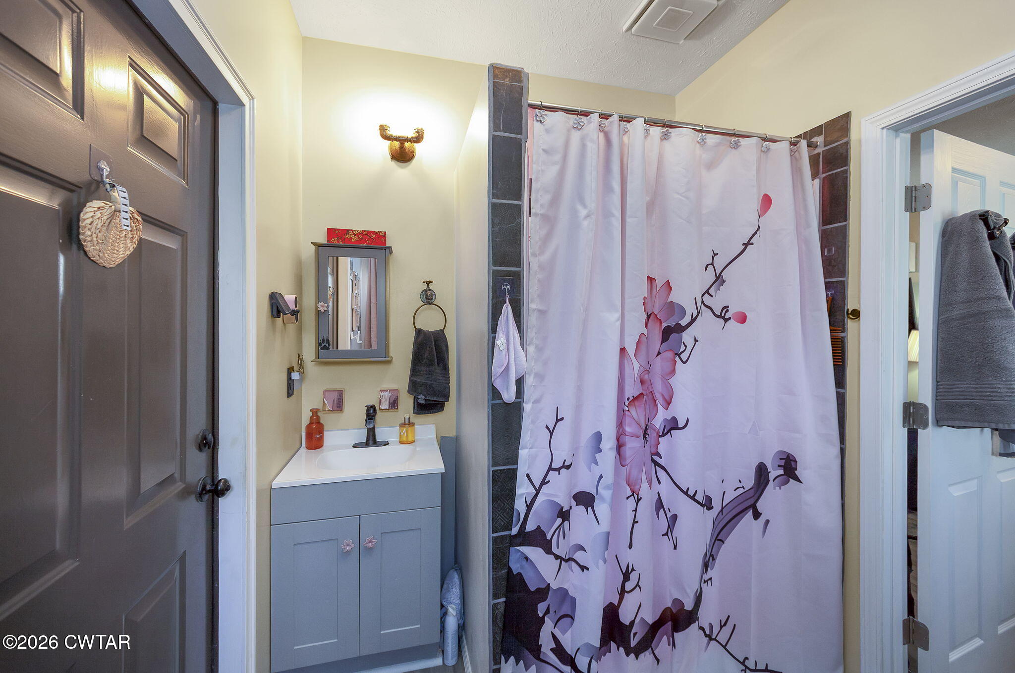 372 Aubrey Fergerson Road Gadsden, TN 38337 - Photo 46 of 50 a bathroom with a shower and a mirror