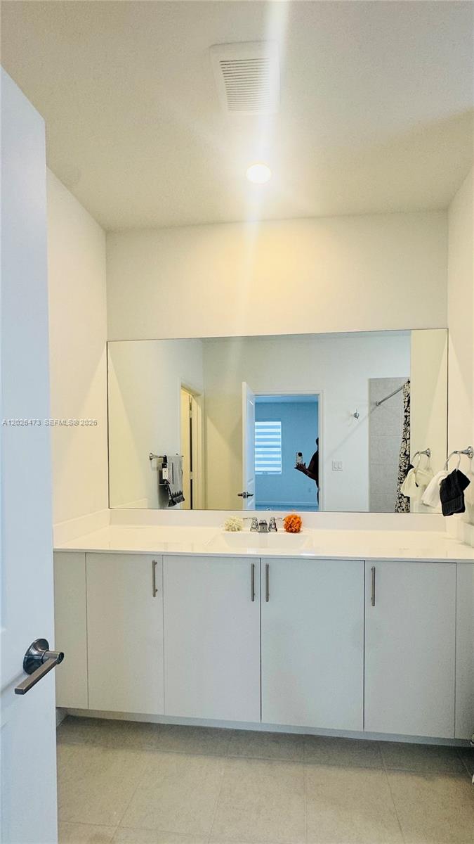 19479 Southwest 340th Street, Unit 1 Homestead, FL 33034 - Photo 27 of 58 a utility room with a sink a washer and dryer