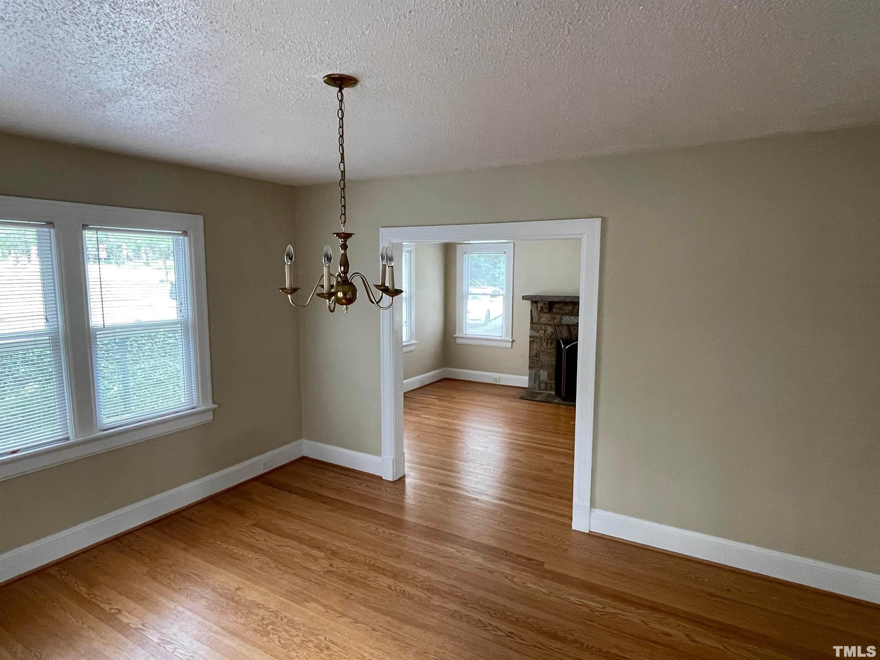 110 Shepherd Street Raleigh, NC 27607 - Photo 6 of 23 a view of a room with wooden floor closet and windows
