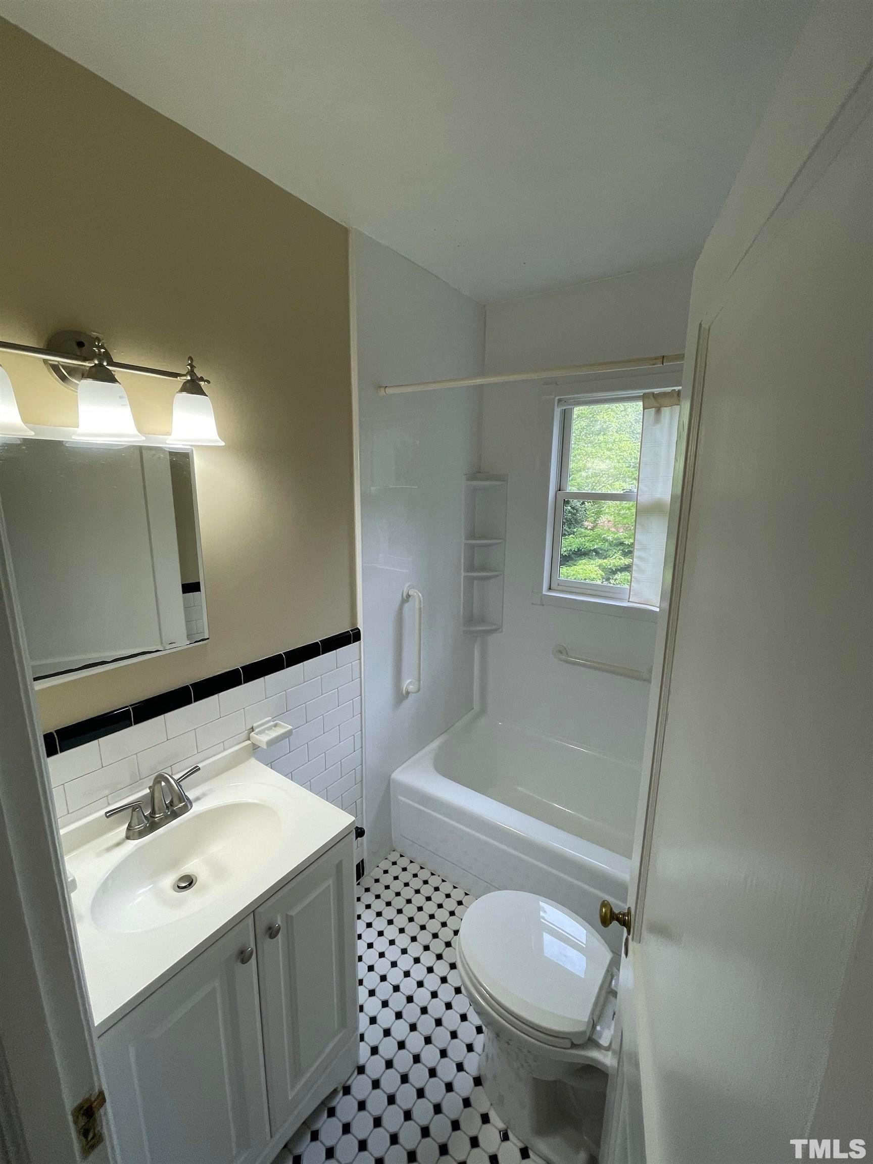 110 Shepherd Street Raleigh, NC 27607 - Photo 10 of 23 a bathroom with a sink toilet and shower