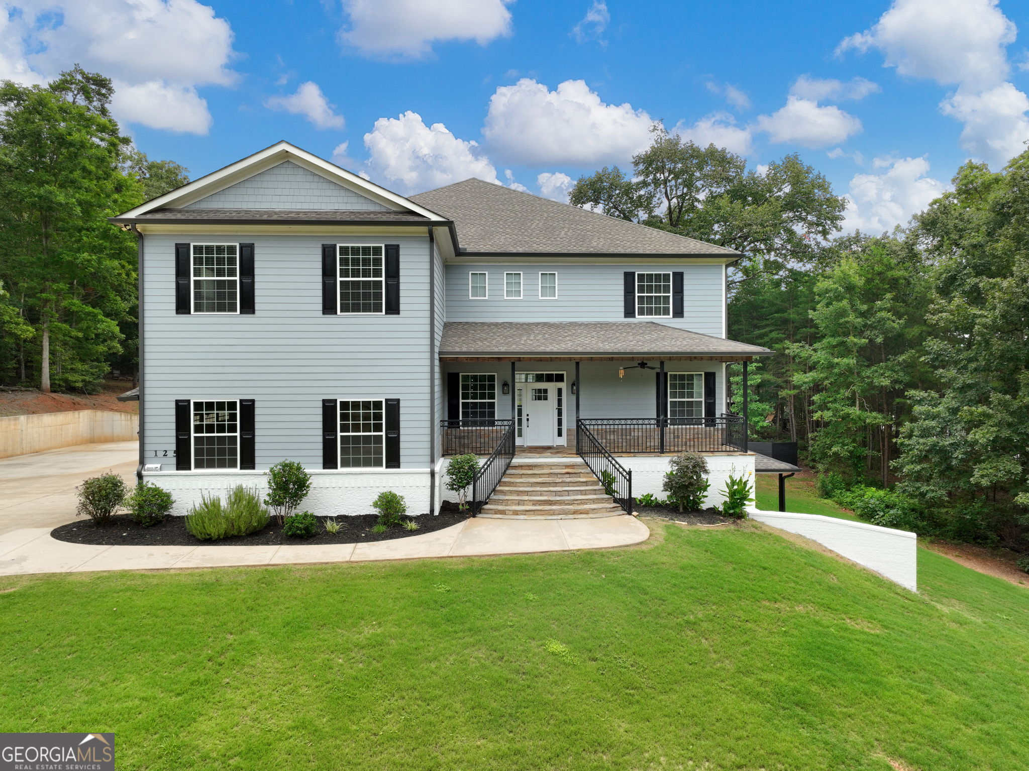 125 Iron Horse Trail Lula, GA 30554 - Photo 1 of 86 a front view of a house with garden