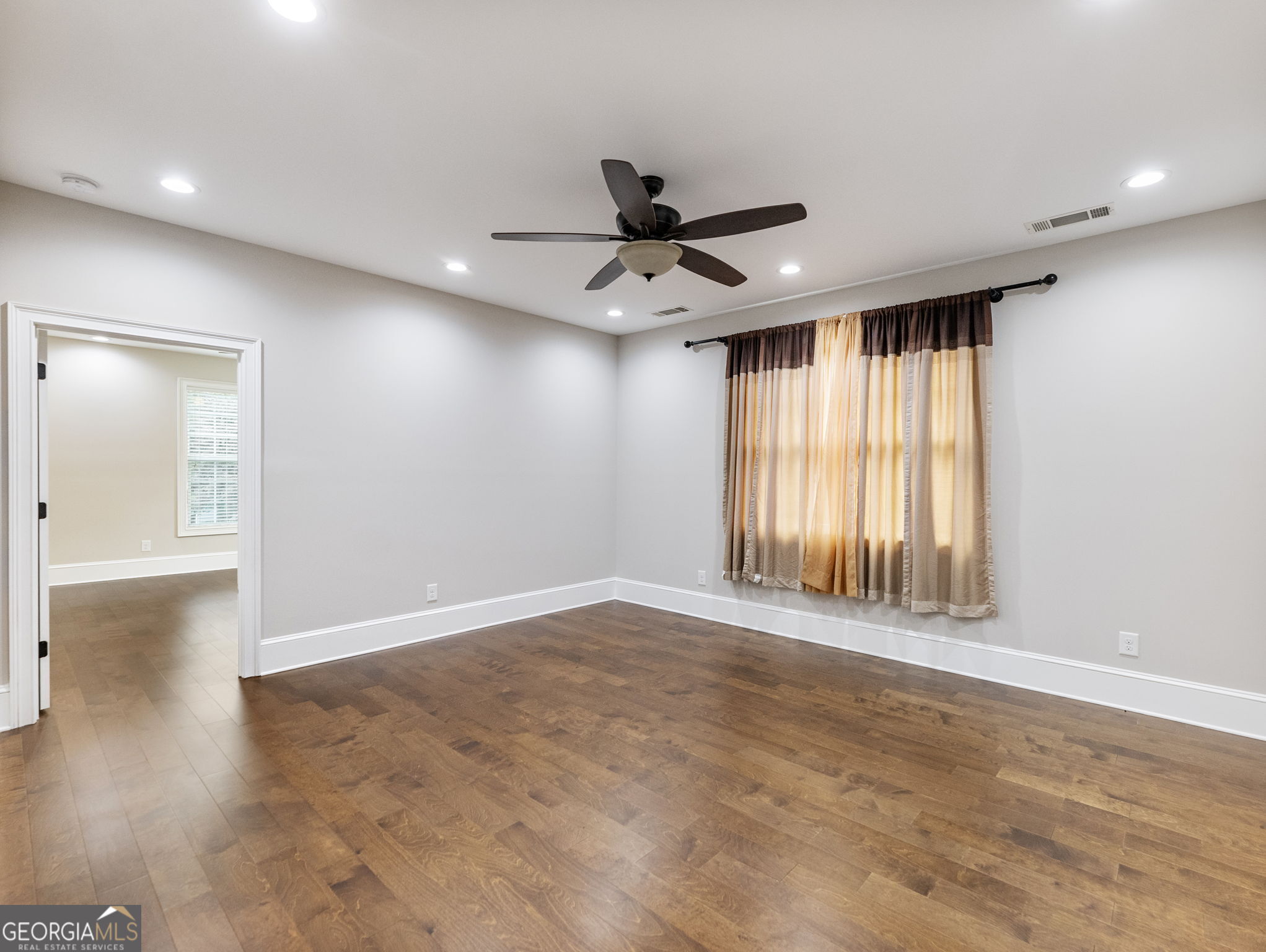 125 Iron Horse Trail Lula, GA 30554 - Photo 31 of 86 a view of an empty room with a window