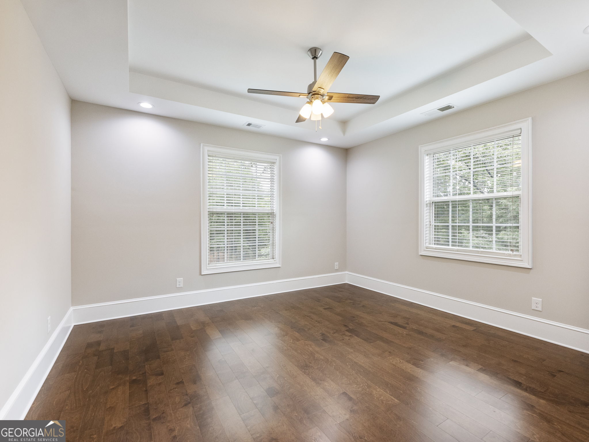 125 Iron Horse Trail Lula, GA 30554 - Photo 33 of 86 wooden floor in an empty room with a window