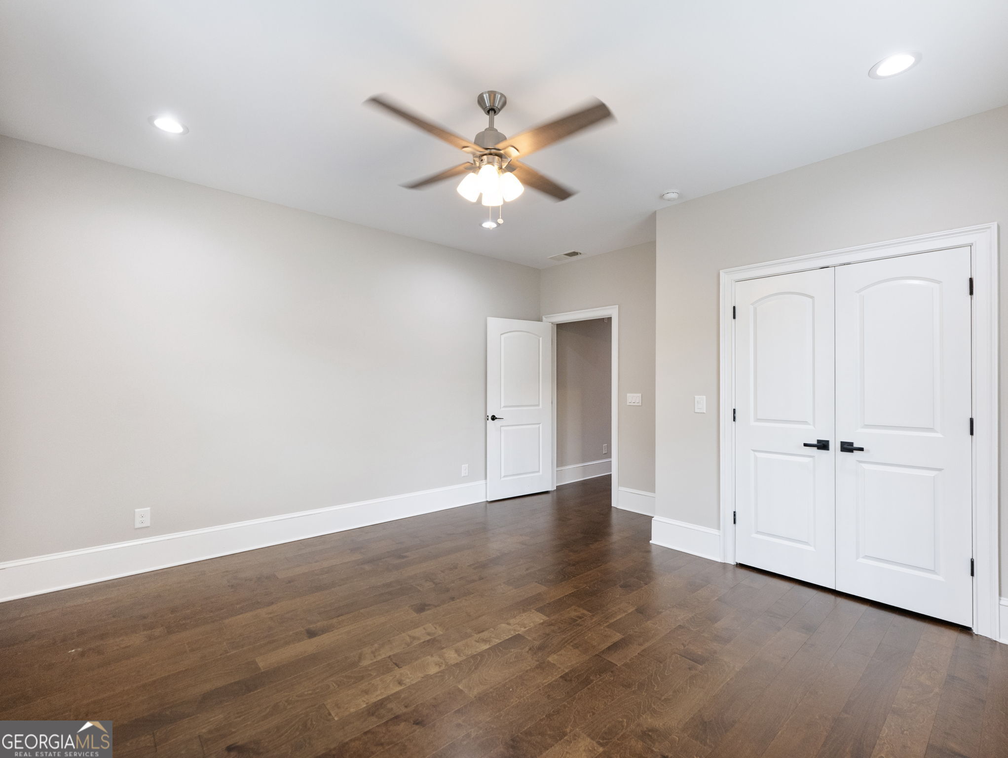 125 Iron Horse Trail Lula, GA 30554 - Photo 36 of 86 wooden floor in an empty room with a window