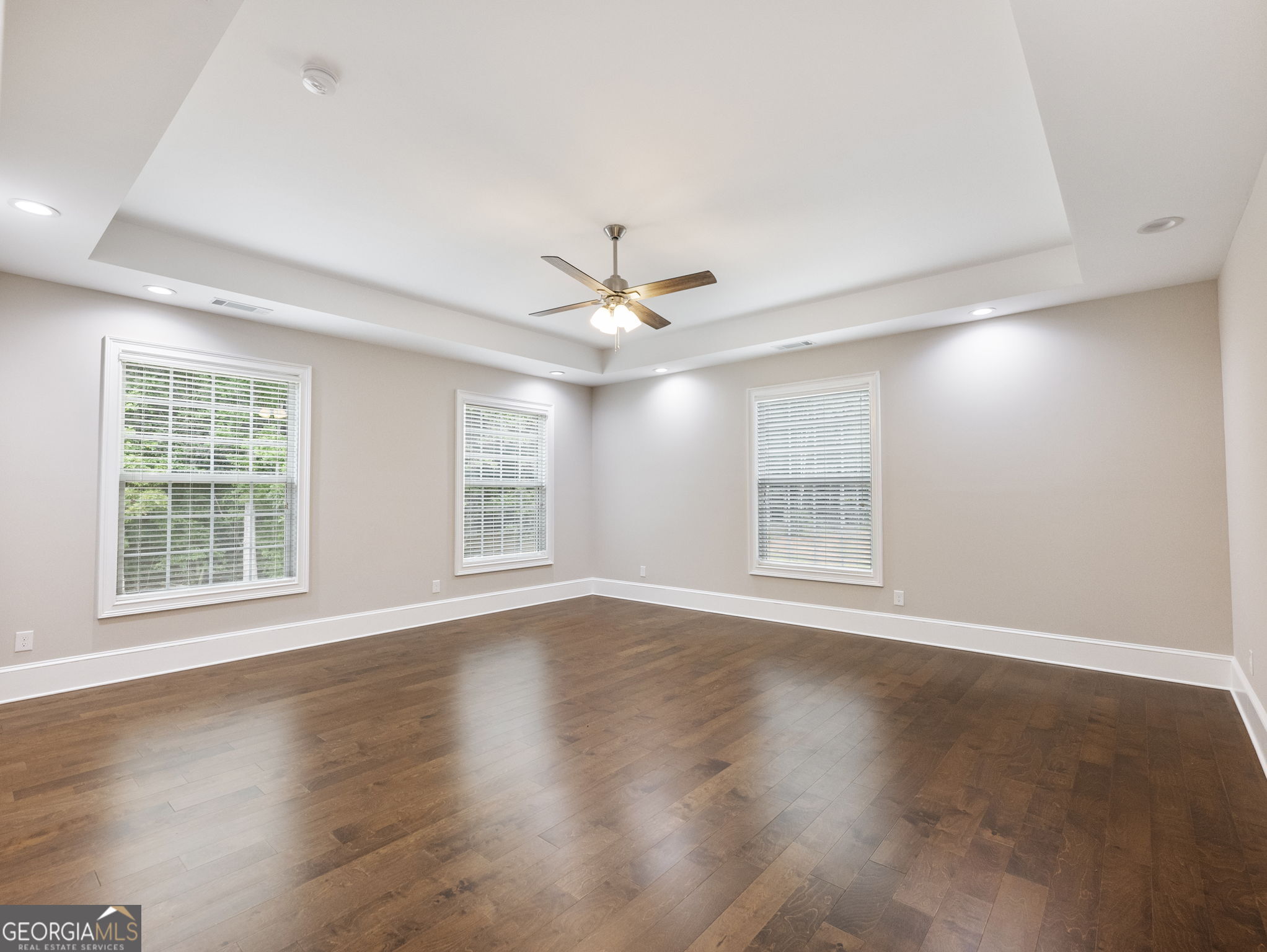 125 Iron Horse Trail Lula, GA 30554 - Photo 39 of 86 a view of an empty room with wooden floor and a window