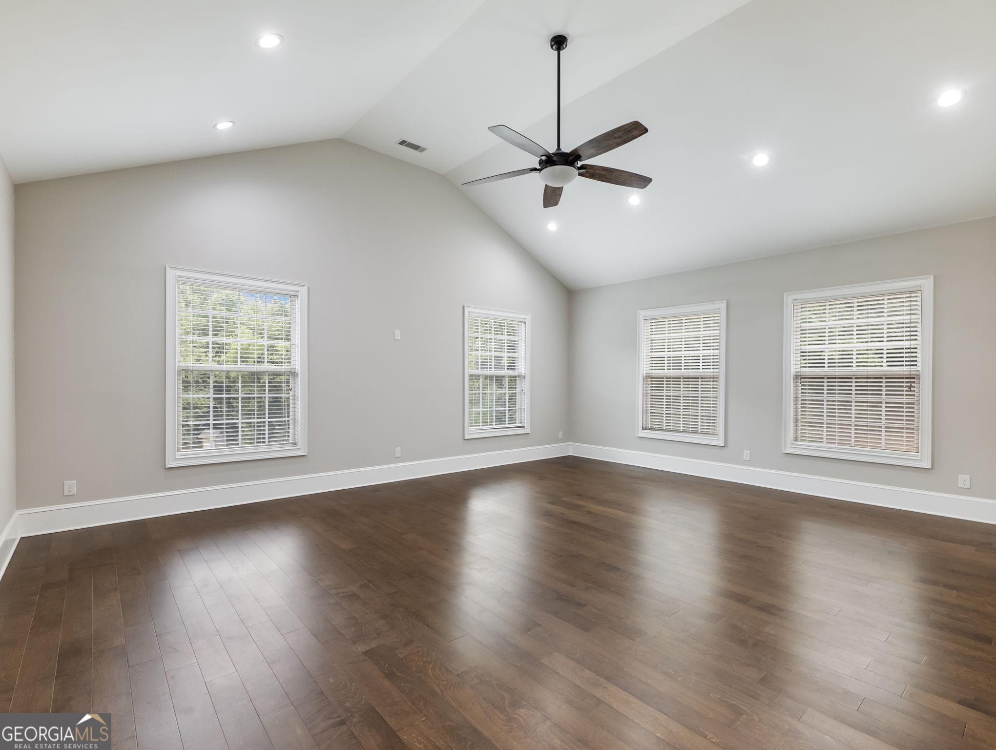 125 Iron Horse Trail Lula, GA 30554 - Photo 47 of 86 a view of an empty room with wooden floor and a window