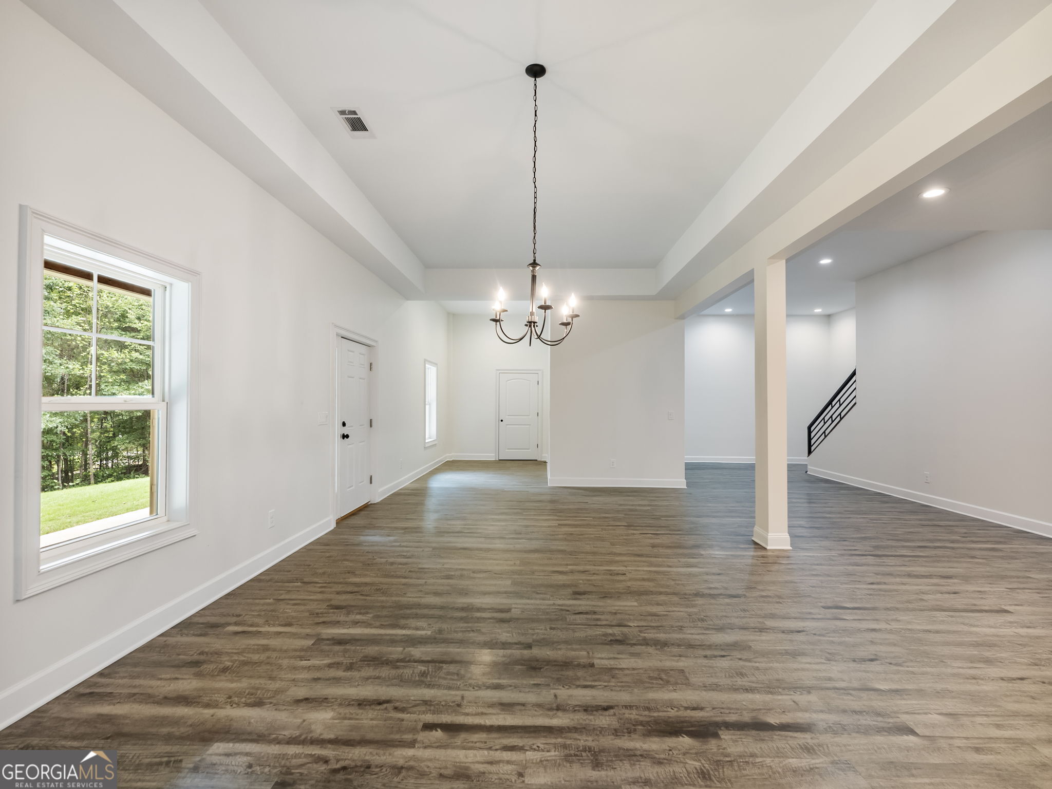 125 Iron Horse Trail Lula, GA 30554 - Photo 58 of 86 a view of empty room with wooden floor and ceiling fan