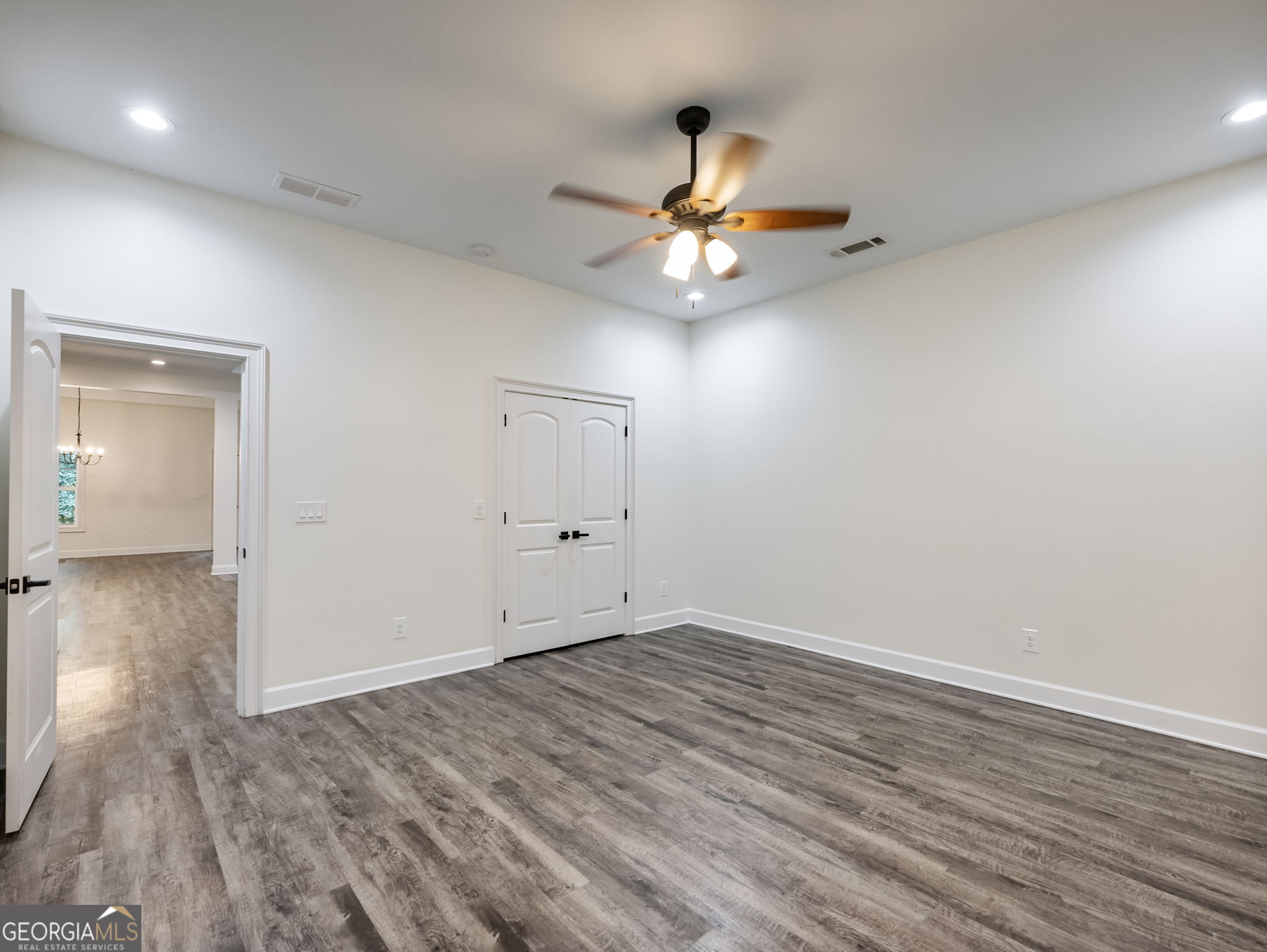 125 Iron Horse Trail Lula, GA 30554 - Photo 64 of 86 wooden floor in an empty room with a window
