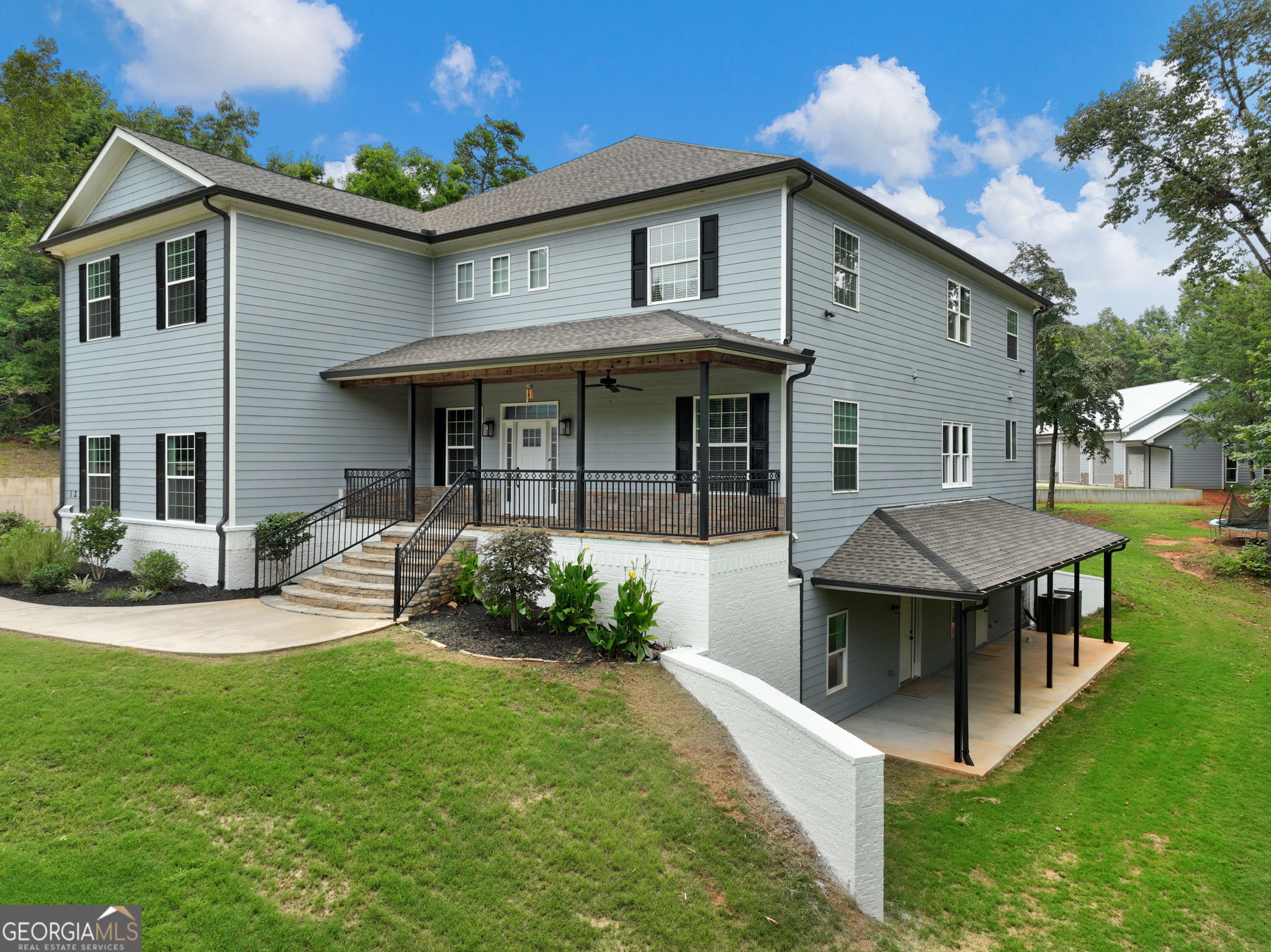125 Iron Horse Trail Lula, GA 30554 - Photo 69 of 86 a view of a house with a yard and furniture