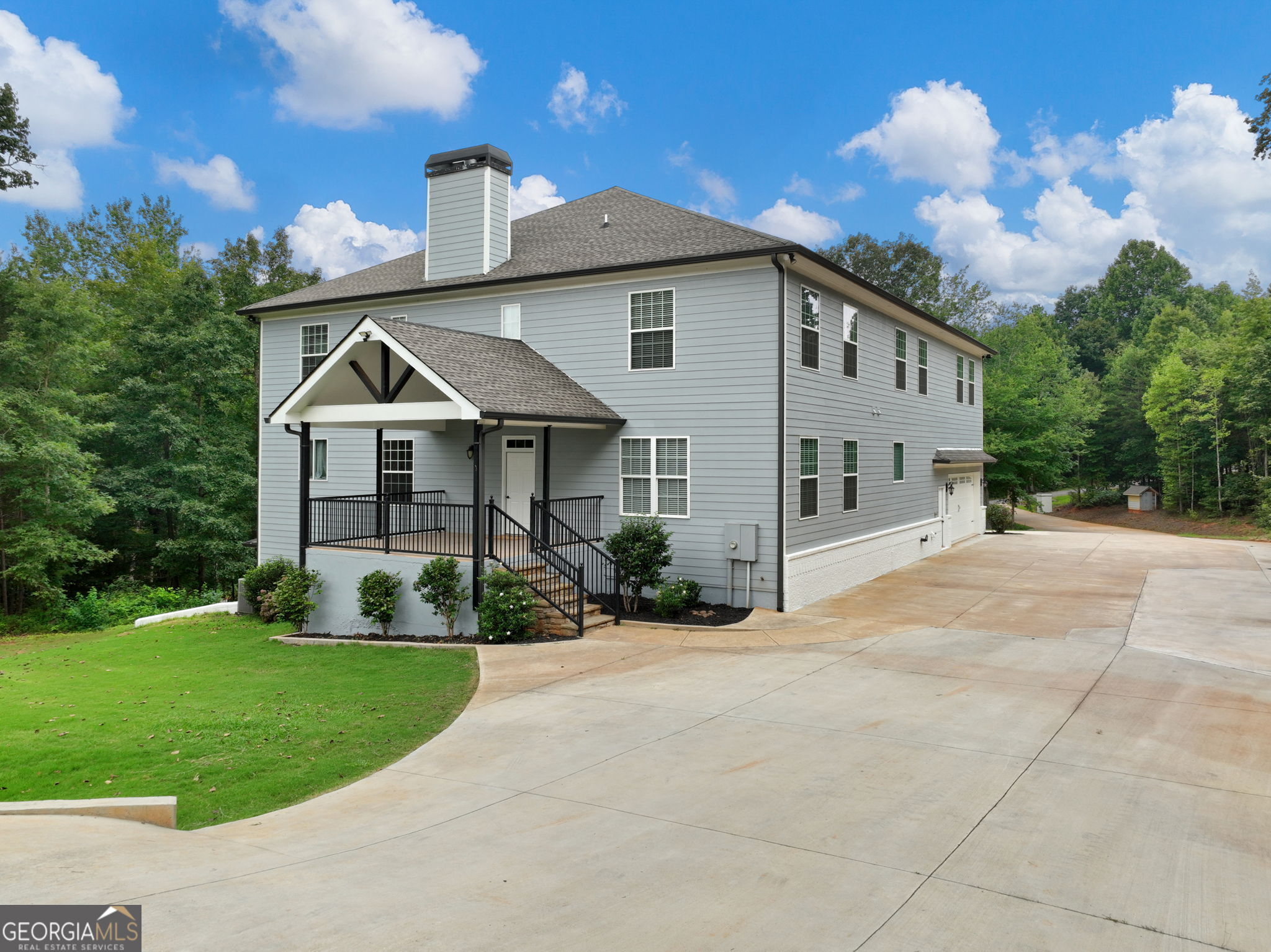 125 Iron Horse Trail Lula, GA 30554 - Photo 75 of 86 a front view of a house with garden