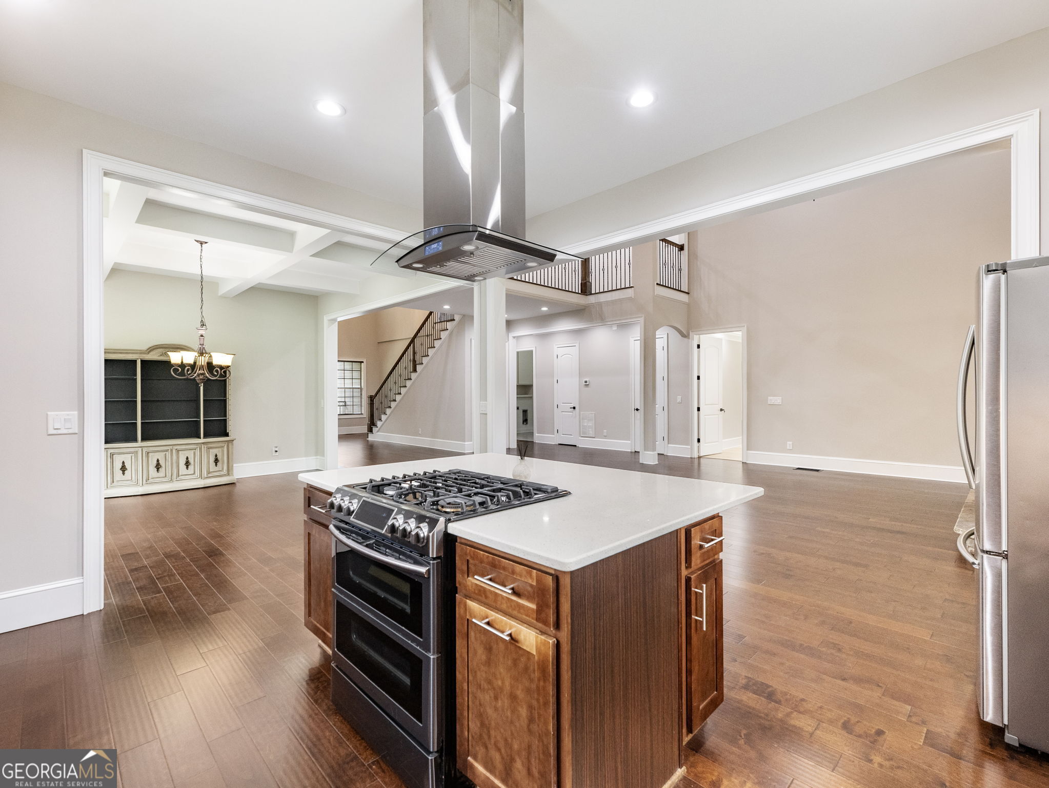 125 Iron Horse Trail Lula, GA 30554 - Photo 10 of 86 a kitchen that has a stove a refrigerator and a wooden floor