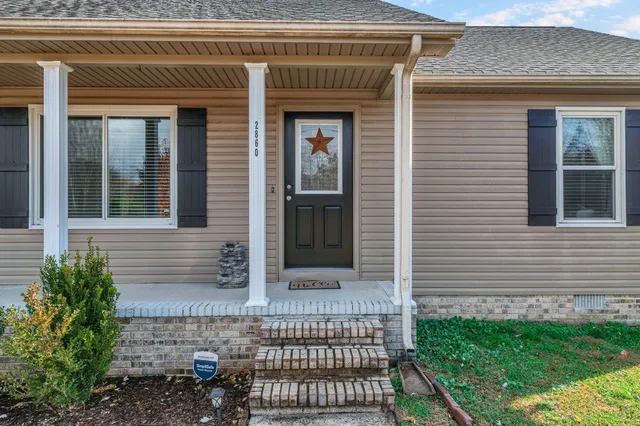 a view of house with front door