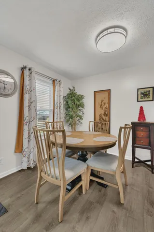 a view of a dining room with furniture