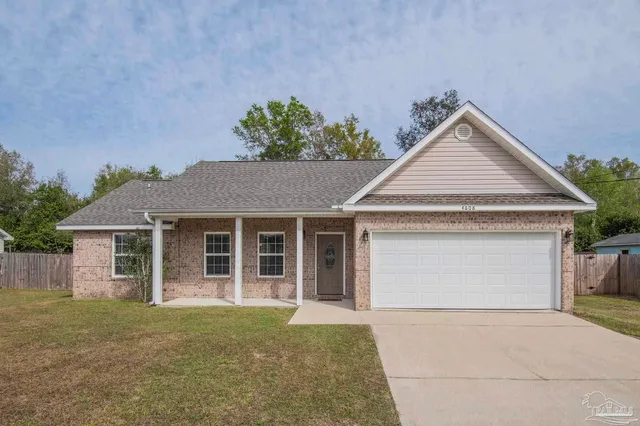 front view of a house with a yard