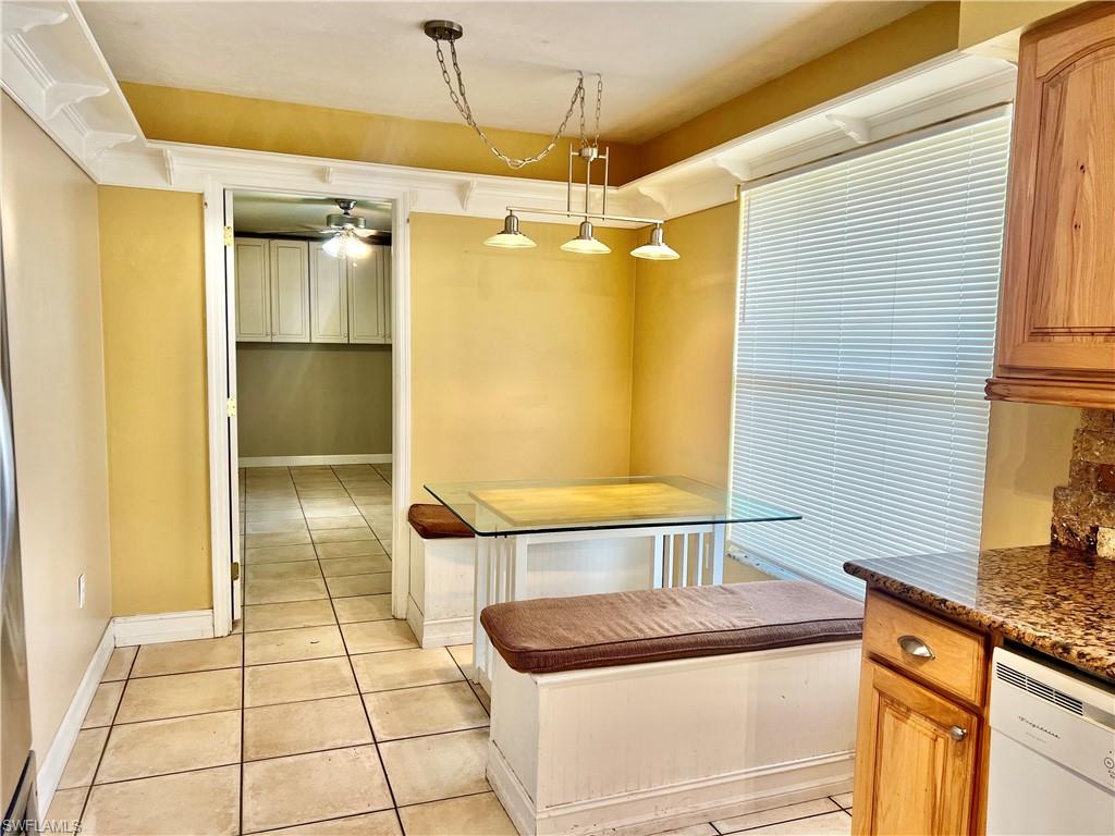 18581 Tampa Road Fort Myers, FL 33967 - Photo 7 of 25 Kitchen with ceiling fan, dishwasher, light tile patterned flooring, and hanging light fixtures