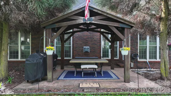 a view of a backyard with sitting area