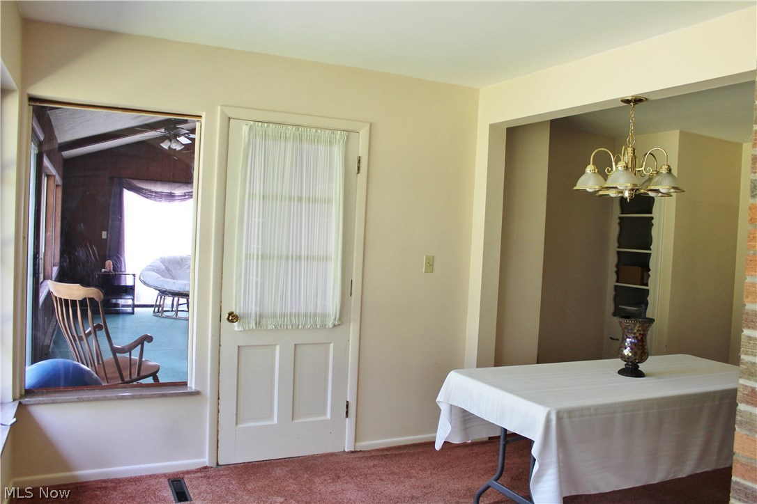 1825 Walnut Road Kent, OH 44240 - Photo 6 of 23 Next to the dining room is the 4-season sunroom with vaulted ceiling. Note the built-in cabinets toward the right of the photo. There is a mirror image cabinet in the same alcove.