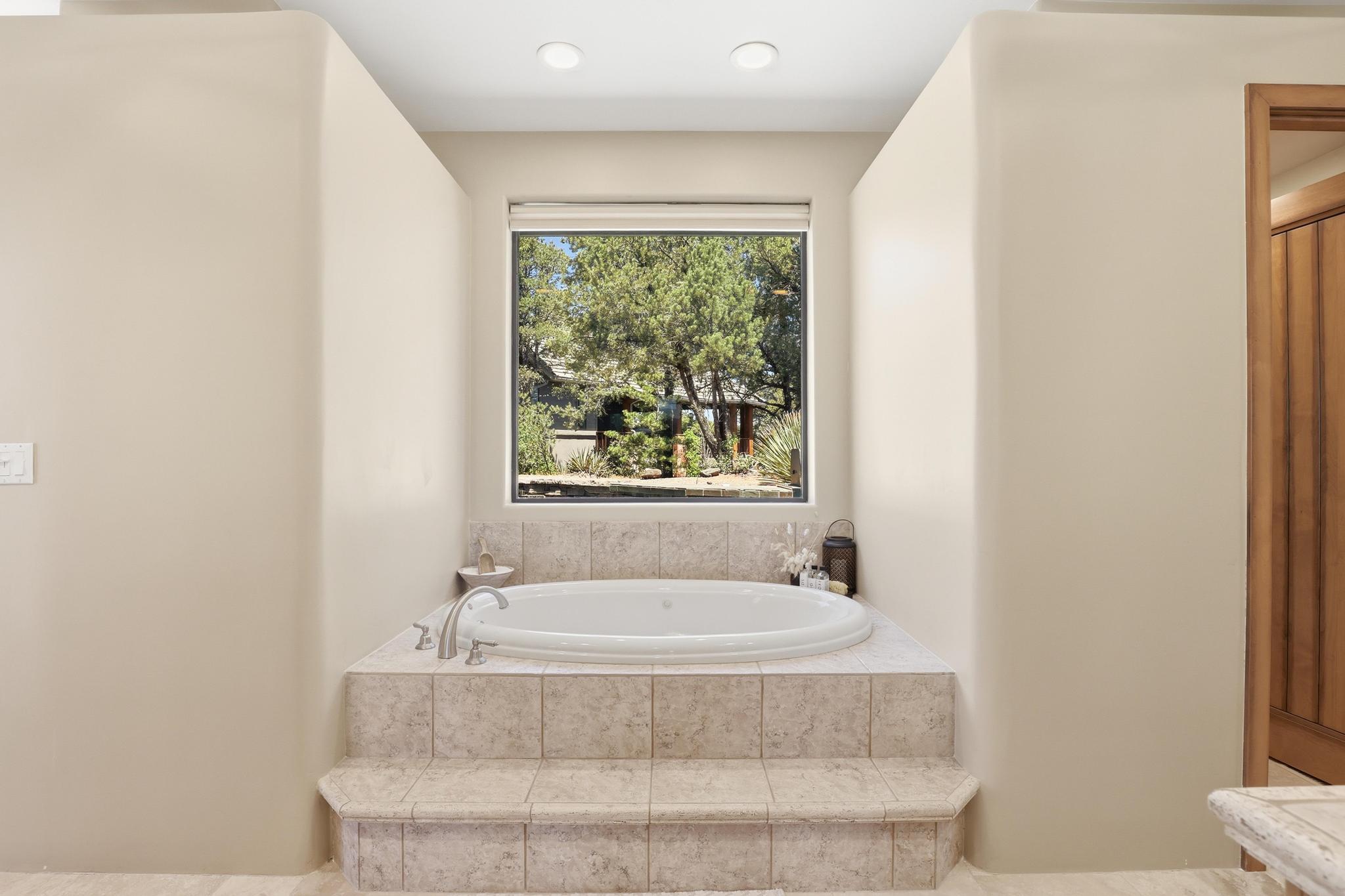 2908 East Rim Club Drive Payson, AZ 85541 - Photo 31 of 77 a bathroom with a bathtub and window