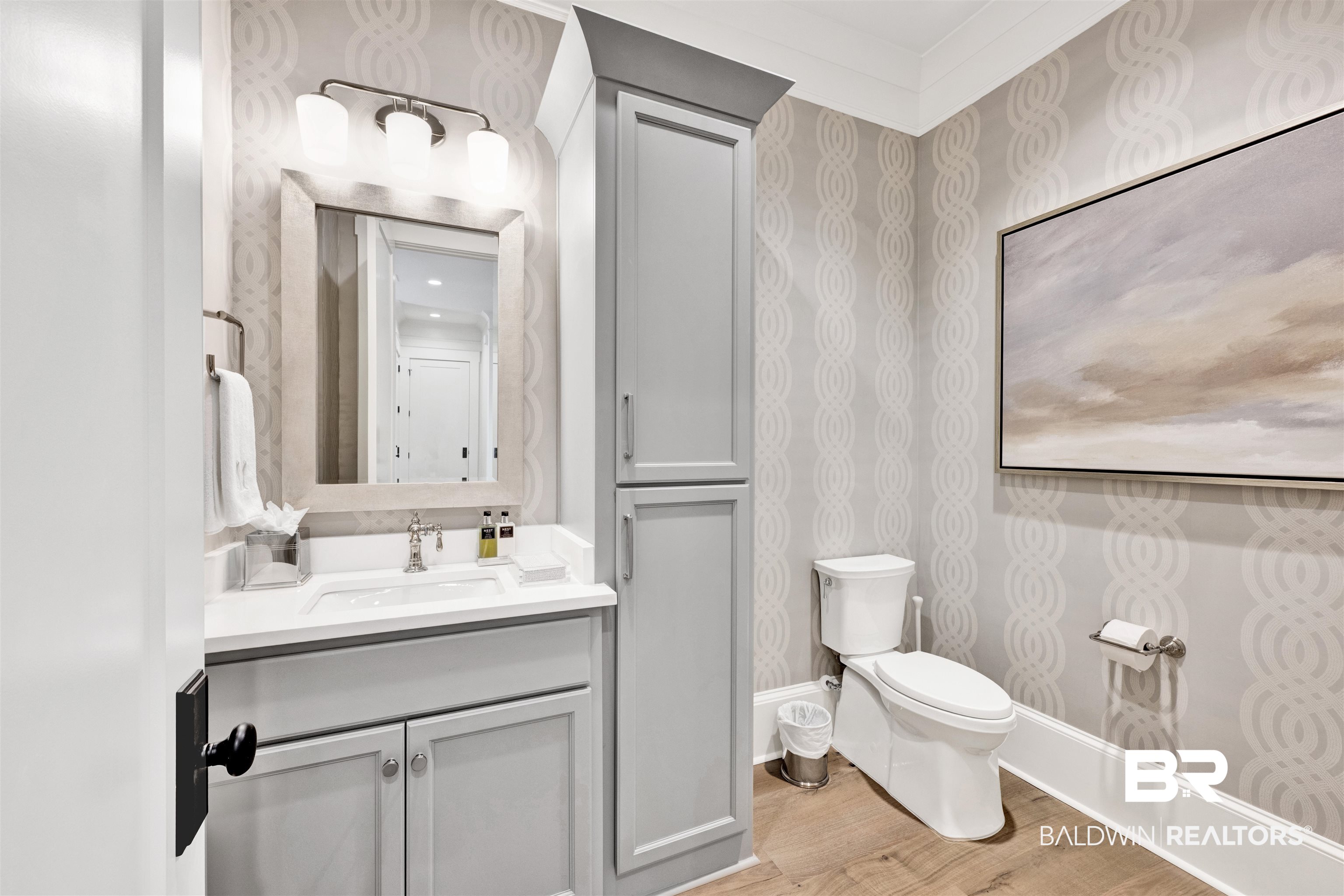 861 Inlet Circle Gulf Shores, AL 36542 - Photo 16 of 54 Bathroom with vanity, light wood finished floors, and crown molding