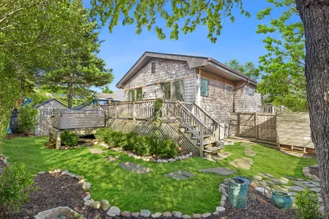 a view of a back yard with plants