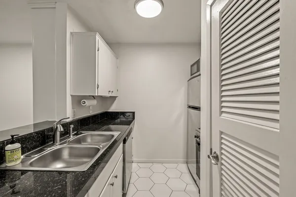 a kitchen that has a sink and a stove