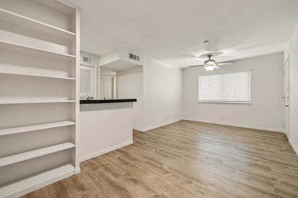 a view of an empty room with a window