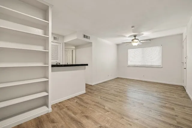 a view of an empty room with a window