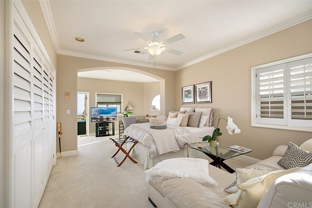 24486 Alta Vista Drive Dana Point, CA 92629 - Photo 11 of 15 a bedroom with a bed and glass door