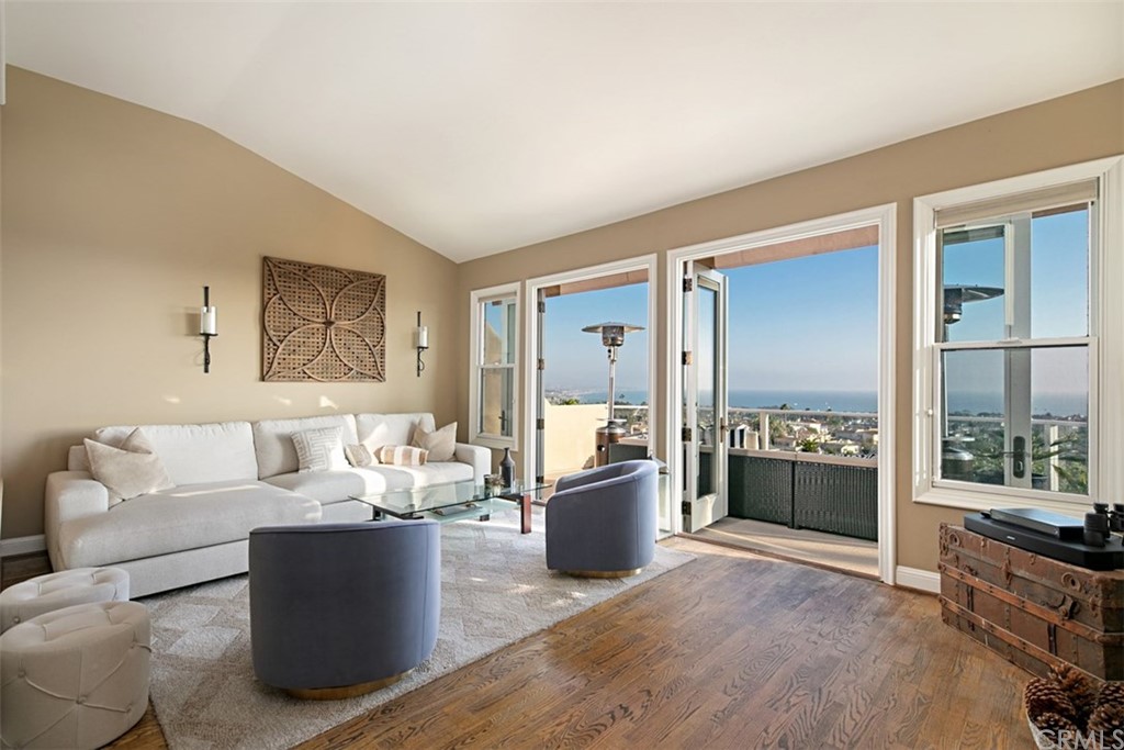 24486 Alta Vista Drive Dana Point, CA 92629 - Photo 3 of 15 a living room with furniture and large windows