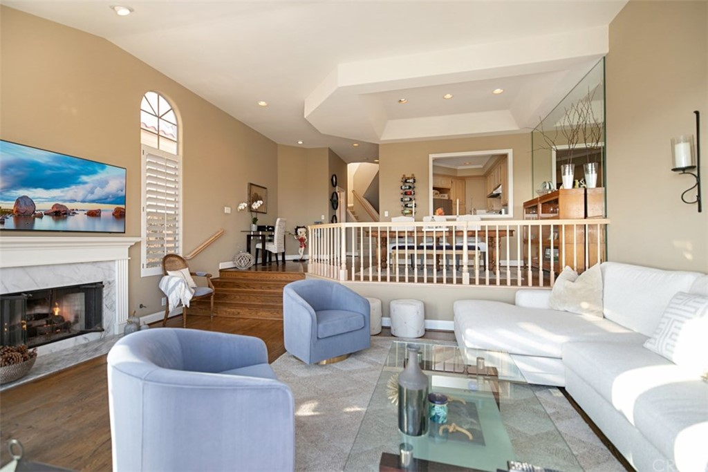 24486 Alta Vista Drive Dana Point, CA 92629 - Photo 4 of 15 a living room with furniture and a fireplace