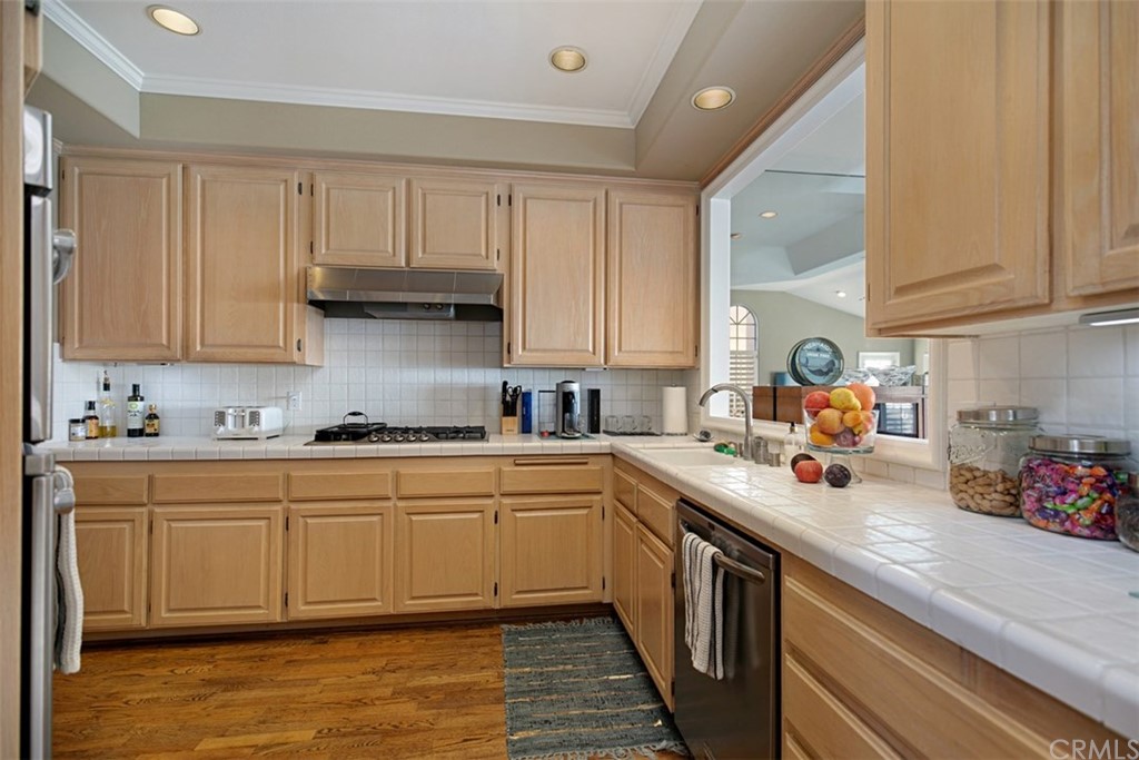 24486 Alta Vista Drive Dana Point, CA 92629 - Photo 5 of 15 a kitchen with stainless steel appliances granite countertop a sink stove and cabinets