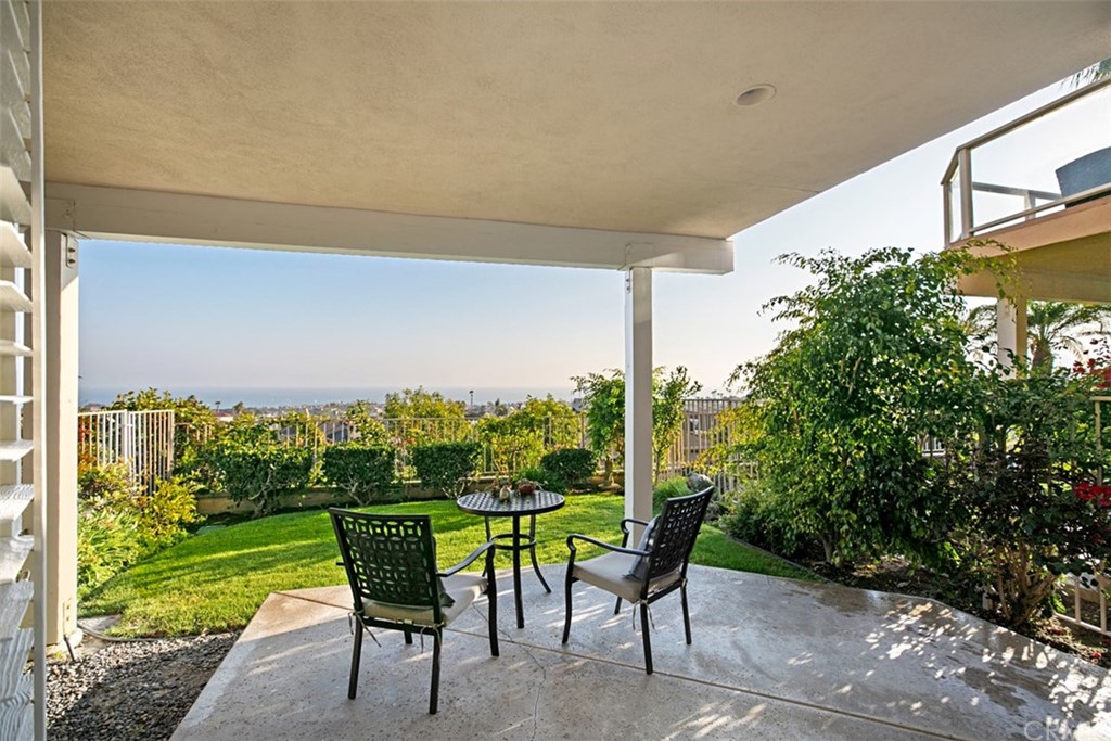 24486 Alta Vista Drive Dana Point, CA 92629 - Photo 8 of 15 a view of a chairs and table in patio