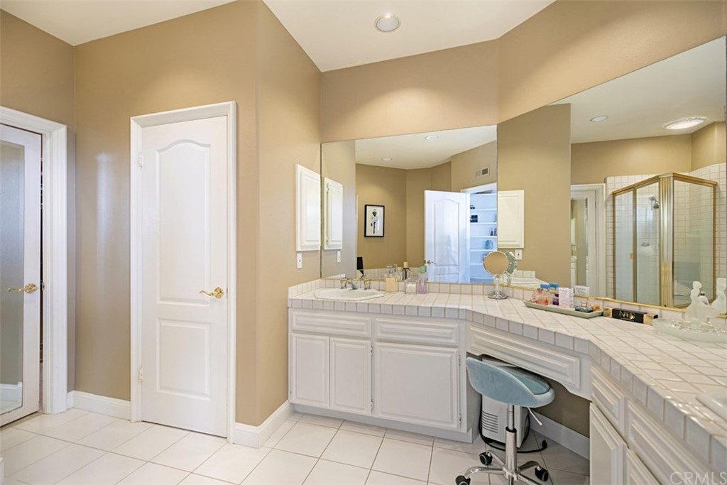 24486 Alta Vista Drive Dana Point, CA 92629 - Photo 9 of 15 a hall with a sink and a mirror