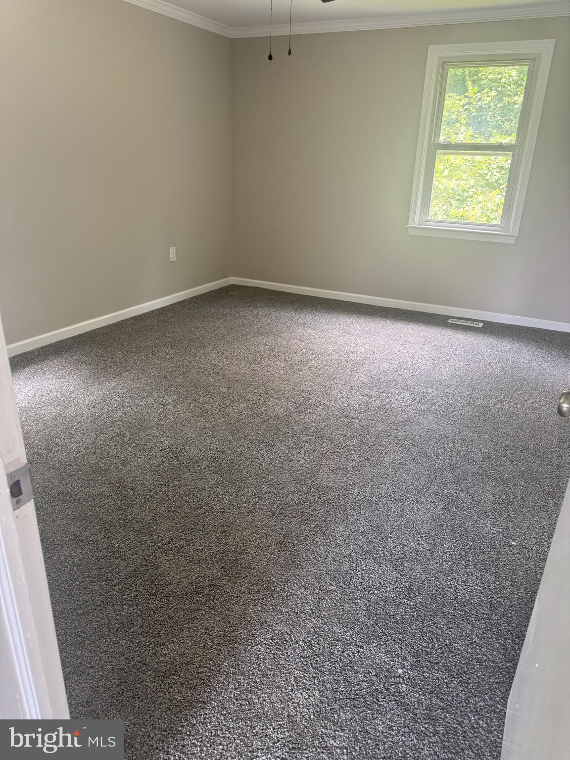 408 Cherry Hill Road Street, MD 21154 - Photo 4 of 17 an empty room with a window
