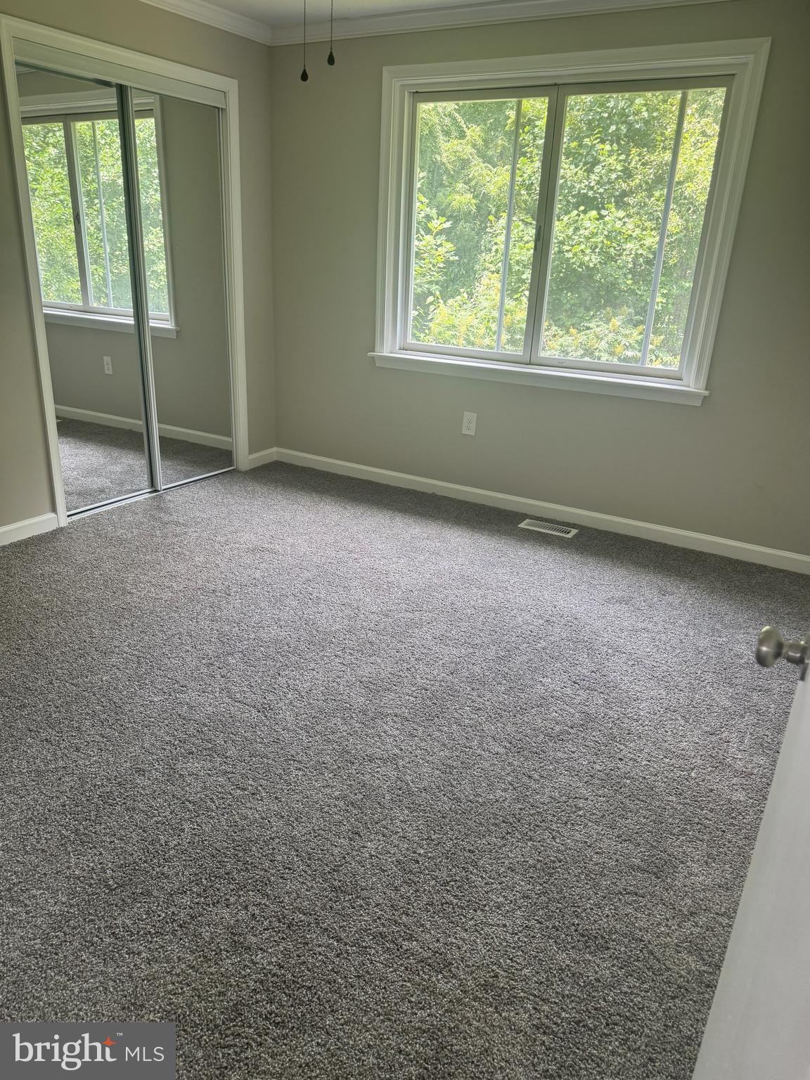 408 Cherry Hill Road Street, MD 21154 - Photo 8 of 17 an empty room with windows