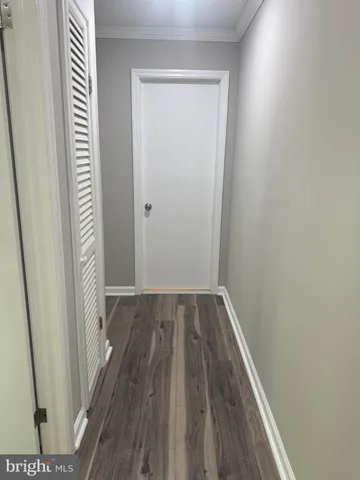 a view of a small space with wooden floor