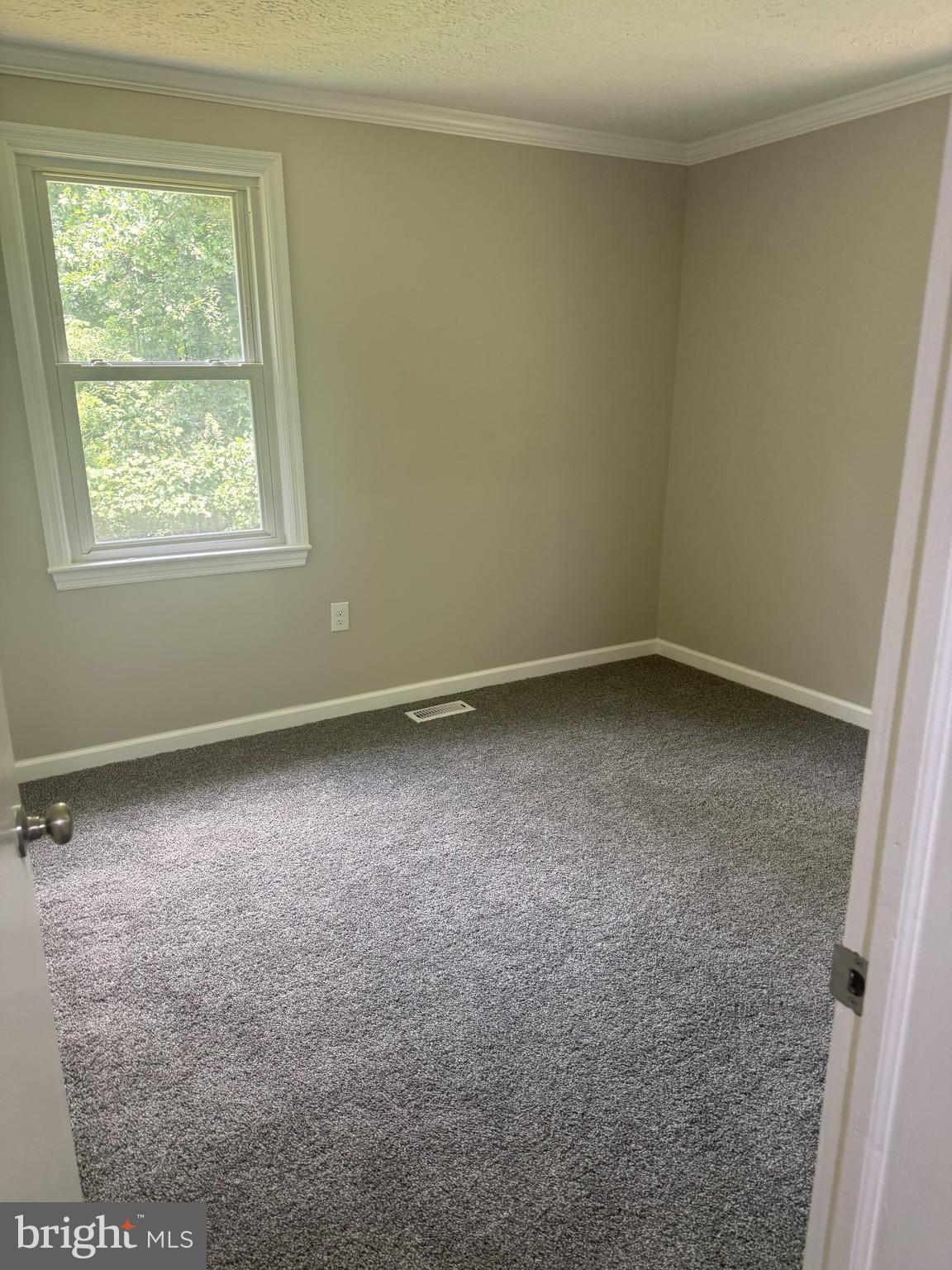 408 Cherry Hill Road Street, MD 21154 - Photo 10 of 17 an empty room with a window