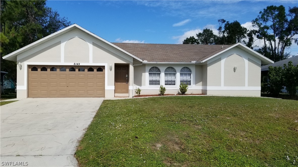 8149 Anhinga Road Fort Myers, FL 33967 - Photo 1 of 14 a view of a house with a yard and potted plants