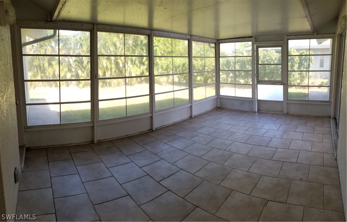 8149 Anhinga Road Fort Myers, FL 33967 - Photo 11 of 14 a view of a livingroom with an empty space and a window