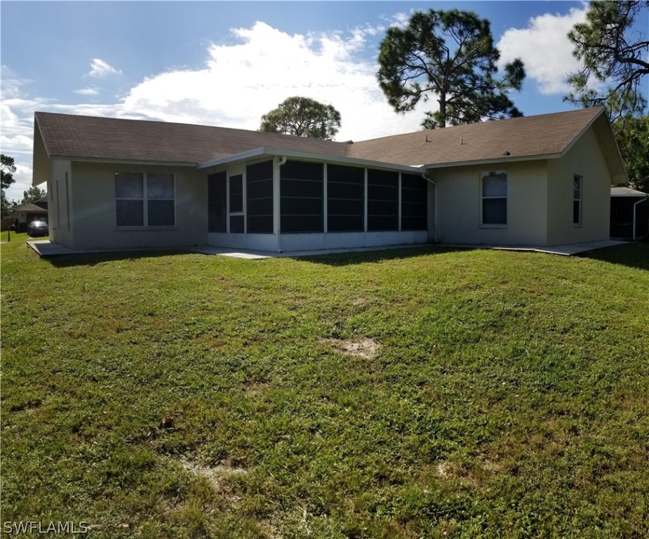 8149 Anhinga Road Fort Myers, FL 33967 - Photo 13 of 14 a view of a house with a garden