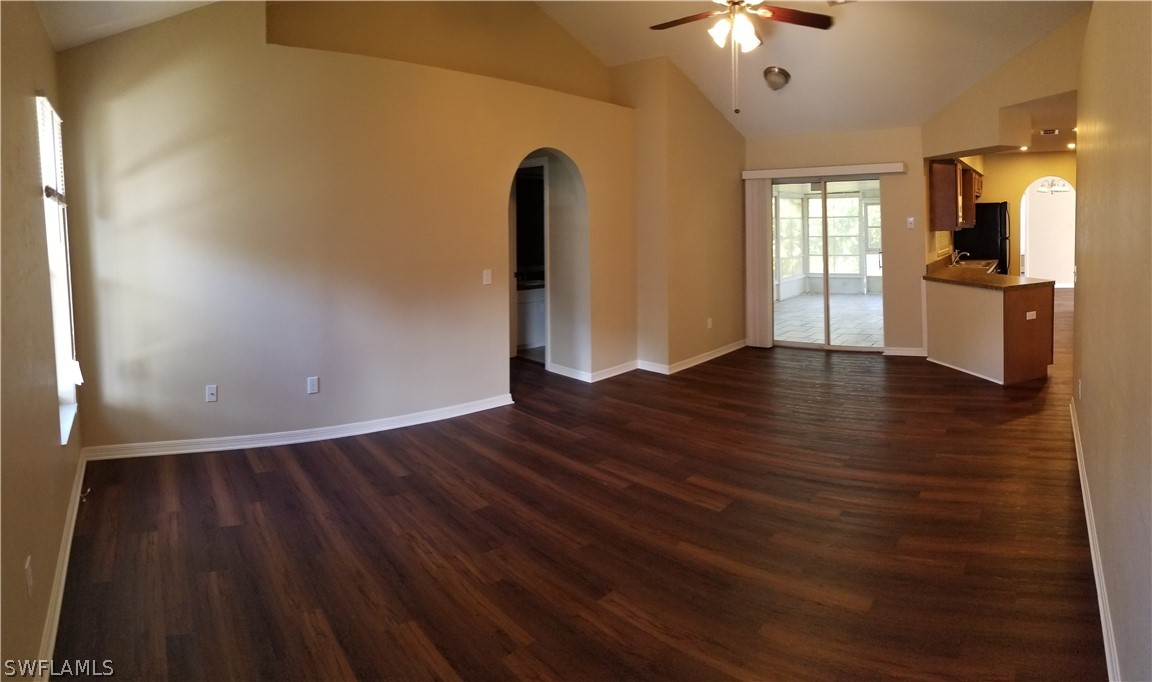 8149 Anhinga Road Fort Myers, FL 33967 - Photo 3 of 14 a view of an empty room with window and wooden floor