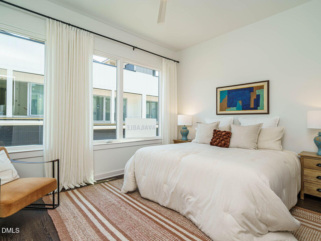 1527 Urban Trace Lane Raleigh, NC 27608 - Photo 15 of 37 a bedroom with a bed and a large window